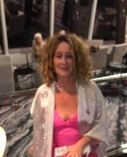 Linds Ksye, Pink Chick Psychic, in a pink dress. Dream Coaching and Guidance sessions